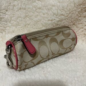 Coach Mini Bag Makeup is in Tan and Pink